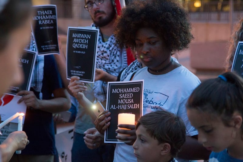 Protestors take a moment of silence for those recently killed in Palestine at the emergency protest for the violence in Gaza in Downtown Atlanta, Georgia, on Tuesday, May 15, 2018. (REANN HUBER/REANN.HUBER@AJC.COM)
