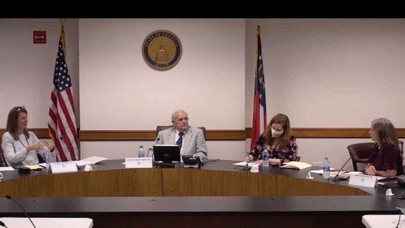 Acting University System of Georgia Chancellor Teresa MacCartney, left, speaks with state senators during a Sept. 15, 2021 committee meeting to discuss mandatory fees for students. (Screenshot)
