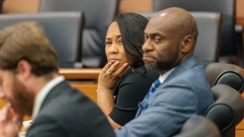 It's unclear whether District Attorney Fani Willis (center) or Special Prosecutor Nathan Wade (right) will appear at a court hearing today in the Donald Trump election case in Fulton County. It's the first hearing since one defendant alleged the pair have had an inappropriate personal relationship. (Arvin Temkar / arvin.temkar@ajc.com)