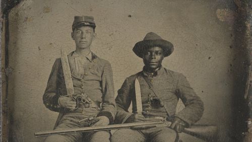 Sergeant A.M. Chandler of the 44th Mississippi Infantry Regiment, Co. F., and Silas Chandler, family slave, with Bowie knives, revolvers, pepper-box, shotgun, and canteen. Photograph shows identified Confederate soldier, A.M. Chandler, and identified slave, Silas Chandler, who accompanied two Chandler brothers during their military service in the Civil War. For more information, see “Glimpses of Soldiers’ Lives,” http://www.loc.gov/rr/print/coll/SoldierbiosChandler.html (Library of Congress)