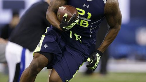 Georgia Southern running back Jerick Mckinnon, who went to Sprayberry High, runs a drill at the NFL football scouting combine in Indianapolis, Sunday, Feb. 23, 2014. (AP Photo/Michael Conroy)