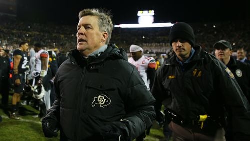 Colorado coach Mike MacIntyre leaves the field after defeating Utah on Nov. 26 in Boulder, Colo. (Photo by Justin Edmonds/Getty Images)