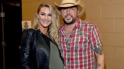 Brittany Kerr Aldean and Jason Aldean pose backstage for the Country Rising Benefit Concert at Bridgestone Arena on Nov. 12, 2017 in Nashville, Tenn. (Photo by Rick Diamond/Country Rising/Getty Images)