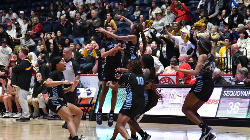 March 11, 2022 Macon - Lovejoy players celebrate their victory over Sequoyah during the 2022 GHSA State Basketball Class AAAAAA Girls Championship game at the Macon Centreplex in Macon on Friday, March 11, 2022. Lovejoy won 54-38 over Sequoyah. (Hyosub Shin / Hyosub.Shin@ajc.com)