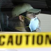 A man waits at a drive-through COVID testing site in 2020. In a break with previous guidelines, the CDC on Friday recommended that those with the virus treat it the same as the flu and RSV — staying home while they have symptoms and fever. (Curtis Compton/AJC 2020 photo)