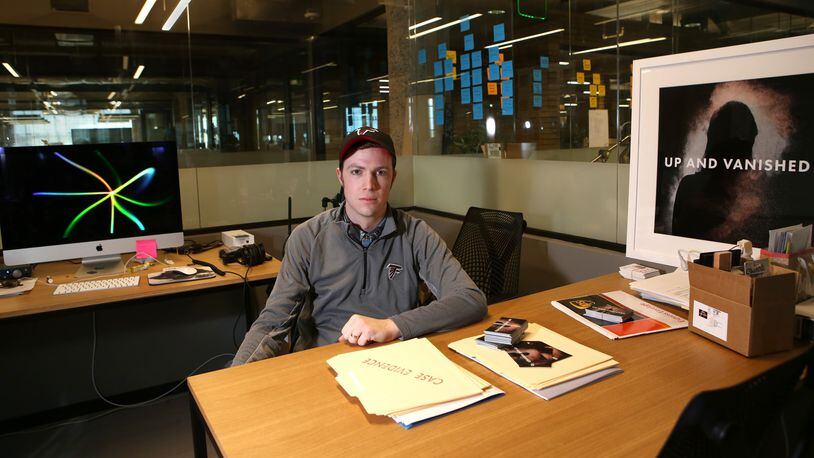 Payne Lindsey poses for a portrait at his desk where he hosts his podcast, “Up and Vanished” at Industrious at Ponce City Market in Atlanta. Lindsey said the state open records law that keeps police investigative files secret is too restricting when it comes to cold cases, like the one his podcast investigated. HENRY TAYLOR / HENRY.TAYLOR@AJC.COM