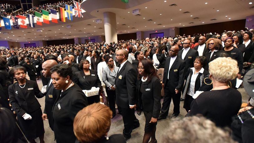 Mourners fill the sanctuary as the processional comes into the church during the homegoing services for Bishop Eddie Long, senior pastor at New Birth Missionary Baptist Church, on Wednesday, Jan. 25, 2017. HYOSUB SHIN / HSHIN@AJC.COM