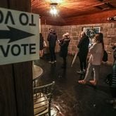 Voters lined up to cast their ballots at Park Tavern in Atlanta on Tuesday, Dec. 6, 2022.