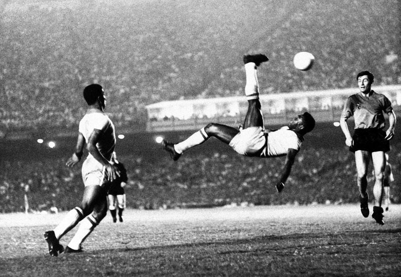 Brazil’s soccer star Pele kicks the ball over his head during a game in September 1968, location unknown. Pele is considered one of the 20th century’s greatest athletes. AP FILE PHOTO