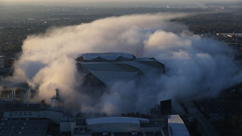 A cloud of dust is all that remains as explosives bring down the Georgia Dome Monday, Nov. 20, 2017, in Atlanta.