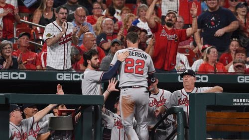 Atlanta Braves' Joc Pederson is congratulated after hitting a home run during the fourth inning of the team's  game against the St. Louis Cardinals on Thursday in St. Louis. (AP Photo/Joe Puetz)