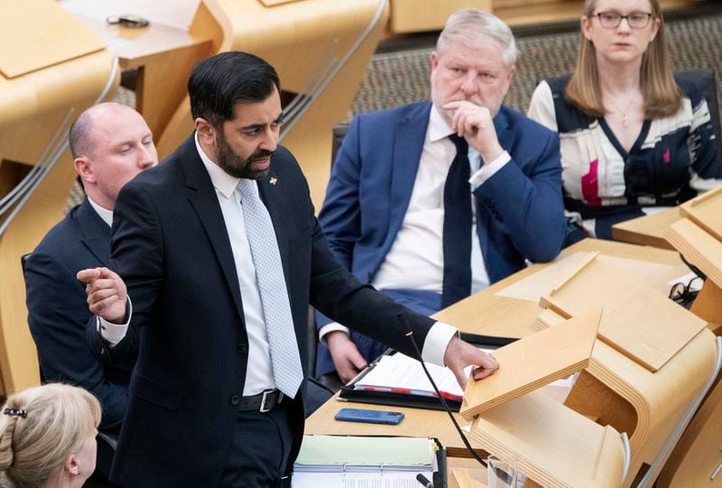 FILE - Scotland's First Minister Humza Yousaf speaks during First Minster's Questions (FMQ's) at the Scottish Parliament in Holyrood, Edinburgh, April 25, 2024. Scotland’s first minister, Humza Yousaf, has resigned on Monday, April 29, 2024, rather than face a no-confidence vote just days after he torpedoed a coalition with the Green Party by ditching a target for fighting climate change. (Lesley Martin/PA via AP, File)