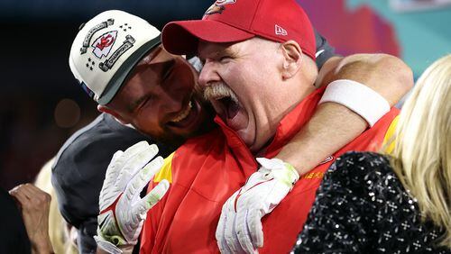 Travis Kelce (87) and head coach Andy Reid of the Kansas City Chiefs celebrate after defeating the Philadelphia Eagles 38-35 in Super Bowl LVII at State Farm Stadium on Sunday, Feb. 12, 2023, in Glendale, Arizona. (Gregory Shamus/Getty Images/TNS)