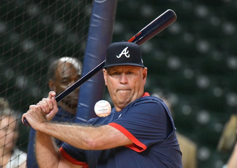 October 25, 2021 Houston, Texas - Atlanta Braves manager Brian Snitker hits a ball during workout in preparation for Game 1 of baseball's World Series against Houston Astros at Minute Maid Park in Houston on Monday, October 25, 2021. (Hyosub Shin / Hyosub.Shin@ajc.com)