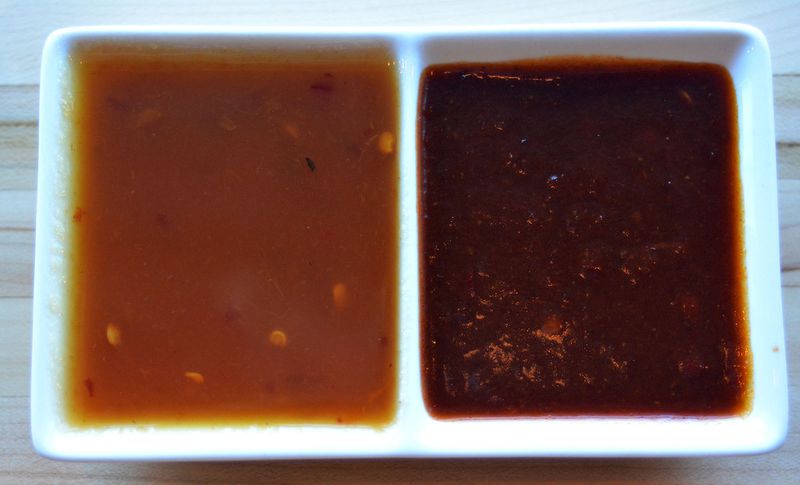 Two of your sauce options at Smoke and Duck Sauce are duck sauce (left) and spicy barbecue (right). STYLED BY CHEF JOE; CONTRIBUTED BY ADRIENNE HARRIS