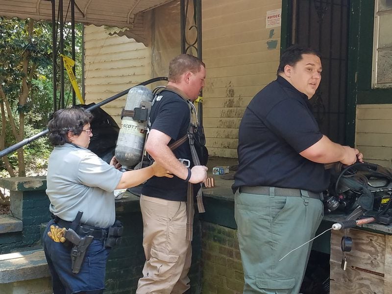 Officers had to wear protective gear to enter the home. (Credit: Hogansville Police Department)