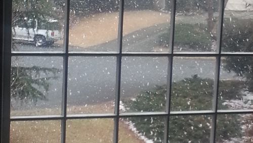 Snow started falling near Kennesaw about 2 p.m. MIKE MORRIS / MMORRIS@AJC.COM