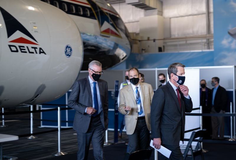 In this file photo, Gov. Brian Kemp and Delta CEO Ed Bastian head to a press conference after touring the COVID-19 vaccination site set up at the Delta Flight Museum in Hapeville.
Ben Gray for The Atlanta Journal-Constitution