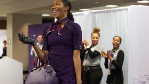 Kyandra Ravenel, a Delta airlines flight attendant, walks the runway during the uniform fitting for Delta employees at Hartsfield-Jackson Atlanta International Airport in Atlanta, Georgia, on Wednesday, February 7, 2018. (REANN HUBER/REANN.HUBER@AJC.COM)