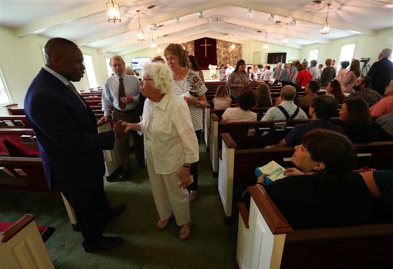 The Rev. Tony Lowden greets visitors and members in the sanctuary of Maranatha Baptist Church in Plains following a worship service in June 2019. Curtis Compton/ccompton@ajc.com