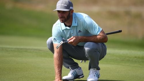 Dustin Johnson demonstrates his version of  a three-point stance prior to this week's Tour Championship at East Lake.(Greg Shamus/Getty Images)