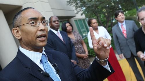 Now-suspended DeKalb CEO Burrell Ellis (far left), with DeKalb County staff members Dr. Jabari Simama, Karen Williams, Nina Hall and Jonathan Weintraub speak during a press conference in front of the Clark Harrison Building in Decatur Thursday, Sept. 2, 2010, in this file photo. Hall (fourth from left) was put on paid leave Monday, April 21, 2014, along with another DeKalb employee after their sworn testimony indicated they were involved in activities that led to corruption allegations against Ellis.