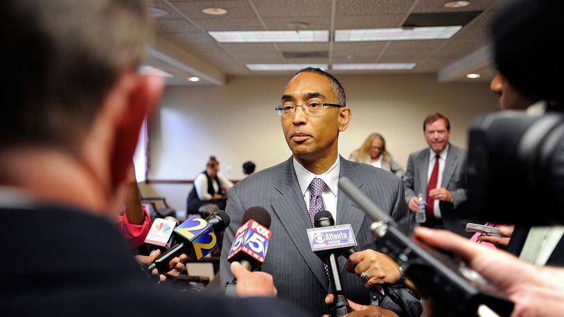 DeKalb County CEO Burrell Ellis responds to to the media after a hearing to determine if the charges against Ellis will interfere with his job running the state’s third-largest county, Monday, July 15, 2013, in Atlanta. David Tulis / AJC Special