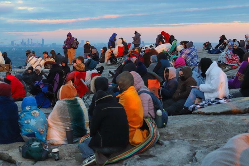 For Easter 2023, worshippers gathered atop Stone Mountain for the annual sunrise service despite 40 degree weather and 25 mph winds. (Photo: Jenni Girtman for The Atlanta Journal-Constitution)