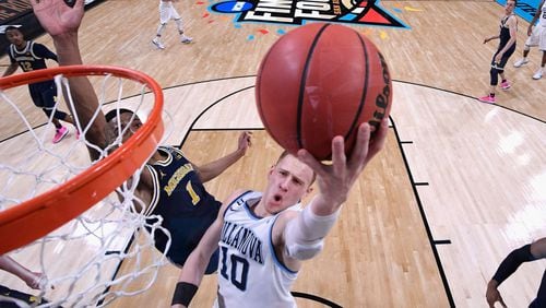 Donte DiVincenzo #10 of the Villanova Wildcats drives to the basket against Charles Matthews #1 of the Michigan Wolverines in the second half during the 2018 NCAA Men's Final Four National Championship game at the Alamodome on April 2, 2018 in San Antonio, Texas.  (Photo by Jamie Schwaberow - Pool/Getty Images)