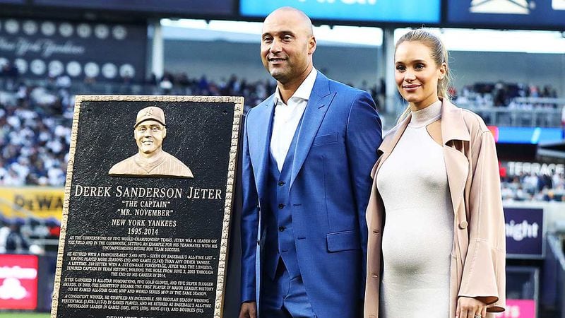 Derek Jeter poses with wife Hannah Davis during the retirement ceremony of his number 2 jersey at Yankee Stadium Sunday.