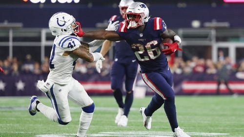 Sony Michel  of the New England Patriots stiff arms Matthias Farley of the Indianapolis Colts as he rushes for a 34-yard touchdown during the fourth quarter at Gillette Stadium on October 4, 2018 in Foxborough, Massachusetts.  (Photo by Adam Glanzman/Getty Images)
