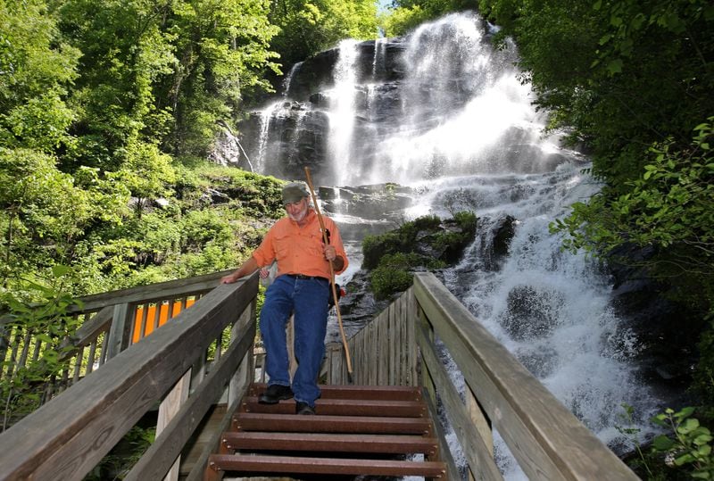 David Moore of Naples, Fla., heads down the staircase with his wife, Pamela (behind him), after they visited the falls at Amicalola Falls State Park. Don't worry, there's an easier way to see these falls.