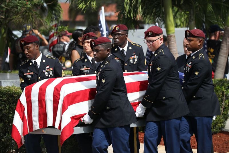 HOLLYWOOD, FL - OCTOBER 21:  U.S. Military honor guards carry the casket of U.S. Army Sgt. La David Johnson during his burial service at the Memorial Gardens East cemetery on October 21, 2017 in Hollywood, Florida. Sgt. Johnson and three other American soldiers were killed in an ambush in Niger on Oct. 4.  (Photo by Joe Raedle/Getty Images)