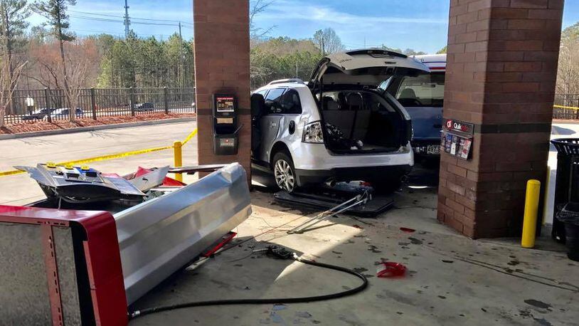 A gas pump at an Alpharetta QuikTrip was knocked over after a crash involving two SUVs, police said. (Credit: Alpharetta Department of Public Safety)