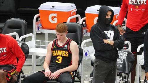 070121 Milwaukee: Atlanta Hawks guards Kevin Huerter (left) and Trae Young, who did not play, watch from the bench in the final minute of a 123-112 loss to the Milwaukee Bucks in game 5 of the NBA Eastern Conference Finals on Thursday, July 1, 2021, in Milwaukee.   “Curtis Compton / Curtis.Compton@ajc.com”