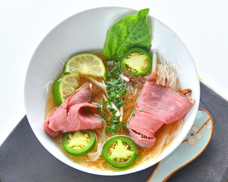Vietnamese Weeknight Beef Pho calls for garnishes such as jalapeño slices and lime wedges. STYLING BY LISA HANSON / CONTRIBUTED BY CHRIS HUNT PHOTOGRAPHY