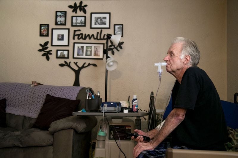 John Tagtmeir does a breathing treatment for his end-stage chronic obstructive pulmonary disease (COPD) at his daughter's apartment recently. He and his wife, who has dementia, had to move in with their daughter so she could care for them. He was receiving hospice care, but was dropped when he lived past the six months allowed by Medicare. He was without care for about a month, and was recently offered palliative care with once-a-month visits. He is among those who would use the benefit of Medicare advance care talks with physicians.