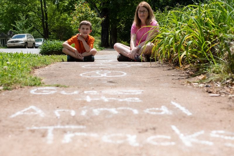 Pam Ryan and her son Robert Ryan, 7, created the “Exeter Challenge” on the sidewalk in front of their Avondale Estates house, which is on Exeter Road. They enjoy watching people, young and old, play along as they walk down the sidewalk. Ben@BenGray.com for The AJC