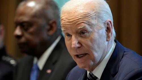 President Joe Biden, right, spoke with Atlanta radio show host Big Tigger on Wednesday to promote his campaign. Biden is pictured seated next to Defense Secretary Lloyd Austin at a recent meeting.