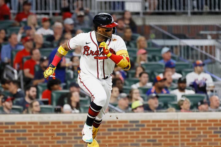 Atlanta Braves right fielder Ronald Acuna Jr. (13) runs to the first base after hitting a single during the second inning of a baseball game against the New York Mets at Truist Park on Saturday, Oct. 1, 2022. Miguel Martinez / miguel.martinezjimenez@ajc.com 