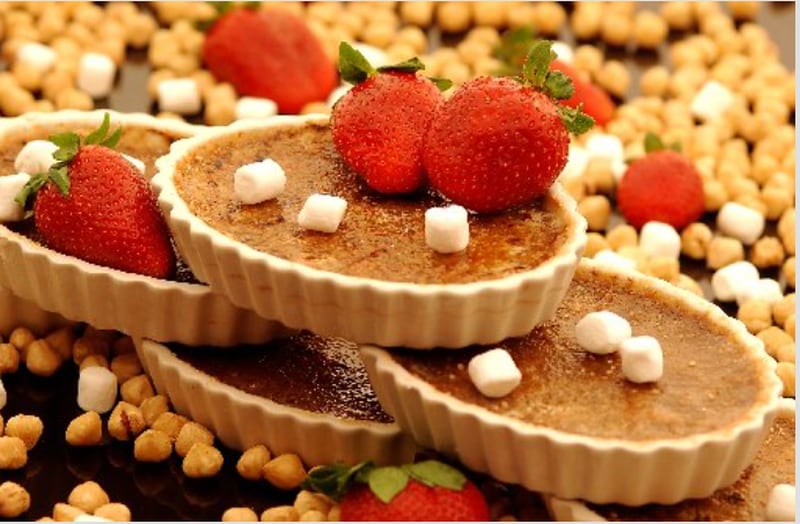 Buckhead Diner Sous Chef Cameron Thompson made this rocky road creme brulee with strawberries in 2003. AJC file