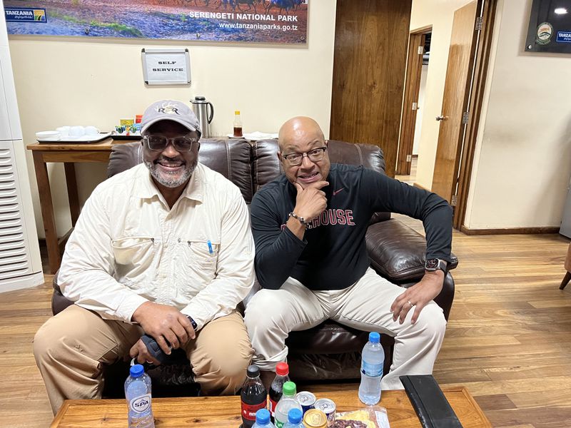 C. David Moody, left, a prominent Georgia businessman and David A. Thomas, president of Morehouse College, relax after arriving in Tanzania. The two plan to tackle Mount Kilimanjaro  soon.