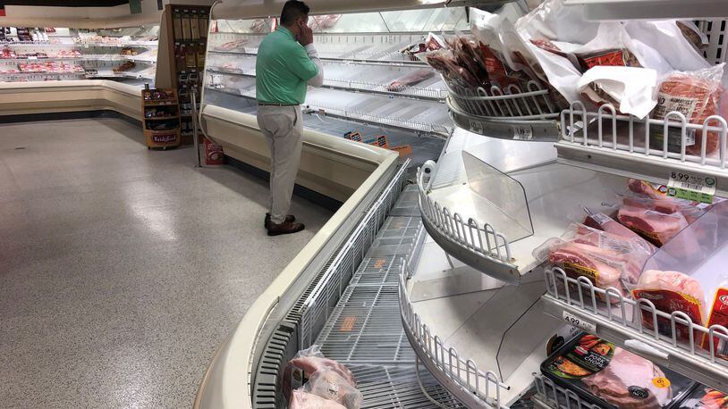 The shortages in meat have been a combination of spiking shopper demand and shutdowns of some Midwestern plants hit by outbreaks of the coronavirus. Here, a Publix in Cobb County with a shortage of fresh beef and chicken. (AJC file photo)