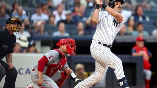 Matt Carpenter (24) of the New York Yankees watches his two-run home run in the first inning as Max Stassi (33) of the Los Angeles Angels looks on at Yankee Stadium on Tuesday, May 31, 2022, in the Bronx borough of New York City. (Elsa/Getty Images/TNS)