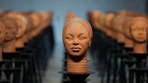 FILE - Sculptures created by French artist Prune Nourry, Inspired by ancient Nigerian Ife terracotta heads, titled "Statues Also Breathe," and representing the remaining 108 Chibok still in captivity are displayed in Lagos, Nigeria, Tuesday, Dec. 13, 2022. The Nigerian army says a girl who was seized from her school along with hundreds others during a raid by extremists ten years ago in northeastern Nigeria has been rescued together with her three children. Lydia Simon was among 276 girls seized from their school in Nigeria’s Chibok village in April 2014. About 82 of them remain in captivity. (AP Photo/Sunday Alamba, File)
