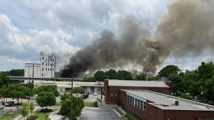 Crews needed a second alarm to extinguish a fire at a former animal feed mill in Chamblee, officials said.