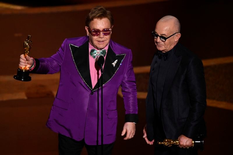 Elton John, left, and Bernie Taupin accept the award for best original song for "(I'm Gonna) Love Me Again" from "Rocketman" at the Oscars on Sunday, Feb. 9, 2020, at the Dolby Theatre in Los Angeles. (AP Photo/Chris Pizzello)