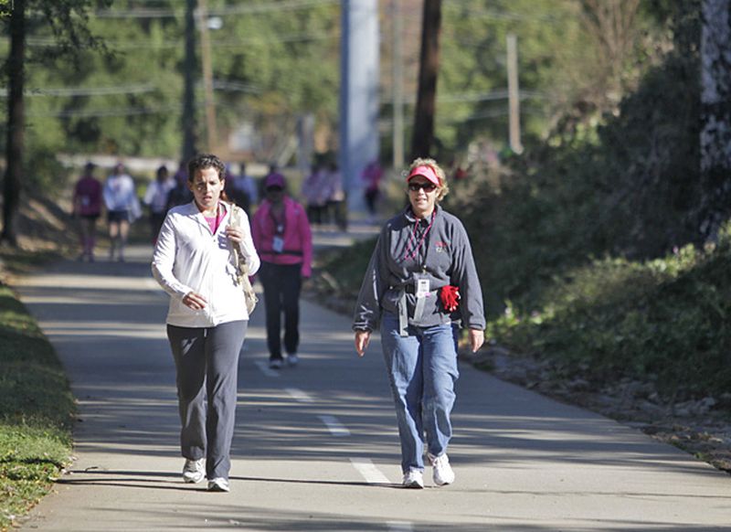 Kimberly Liedigk of Johns Creek (left) and Celine Ostheimer of Canton walk along a section of the Stone Mountain Trail in downtown Clarkston.
