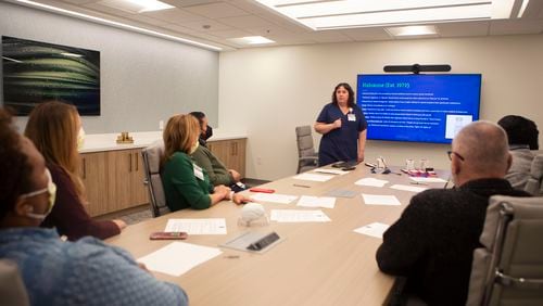 Andy Gish, a registered nurse, trains colleagues at the Emory Addiction Center how to use naloxone, an opioid overdose reversal medication, on Friday, November 18, 2022. CHRISTINA MATACOTTA FOR THE ATLANTA JOURNAL-CONSTITUTION.