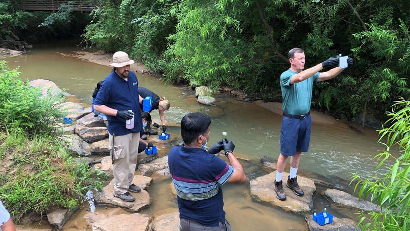 Volunteers with Gwinnett Clean & Beautiful monitor chemicals and bacteria in local streams. (Courtesy Gwinnett Clean & Beautiful)